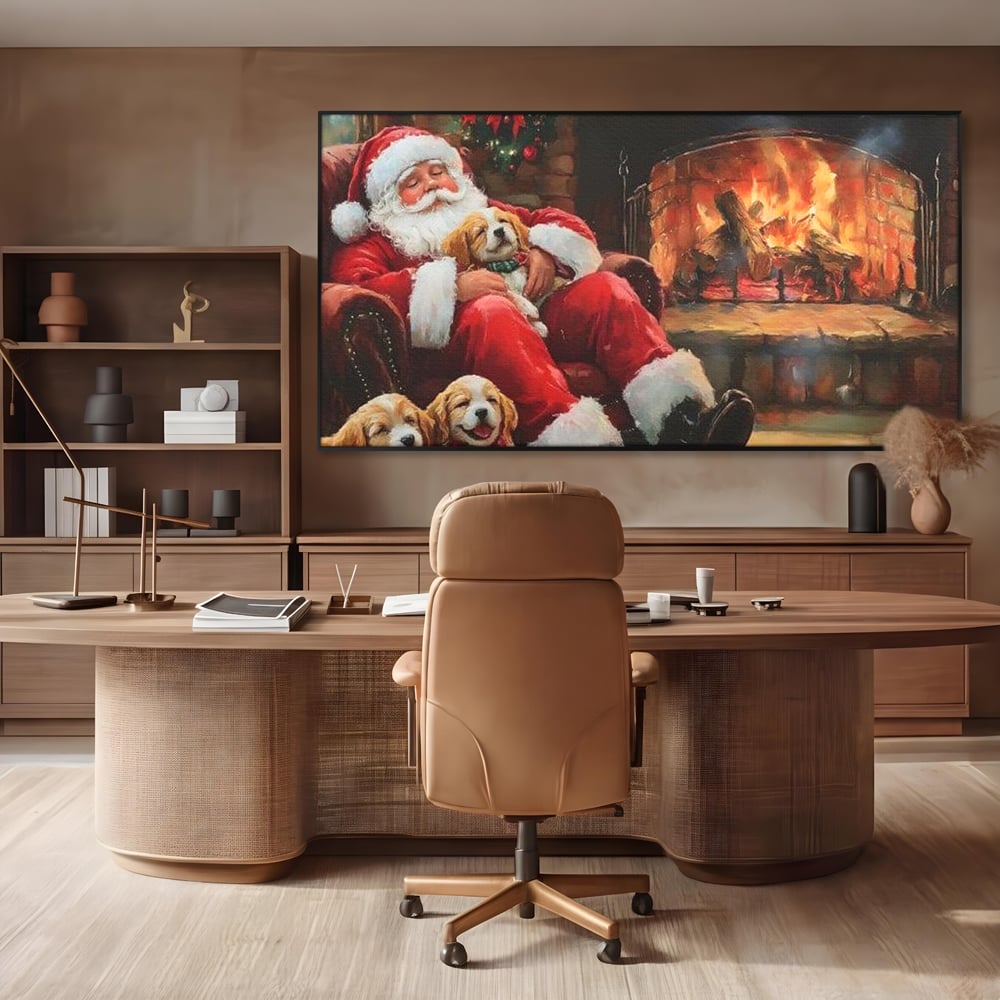 Tablou canvas cu mos craciun dormind cu catei langa semineu, in rama de aluminiu negru, pe perete intr-un birou